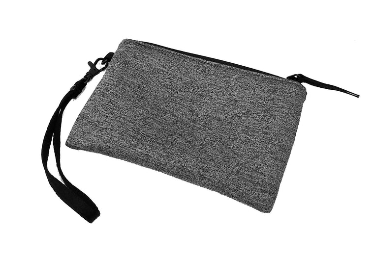 The Smassy wristlet is a small neoprene handbag that provides durability and storage for small items. 